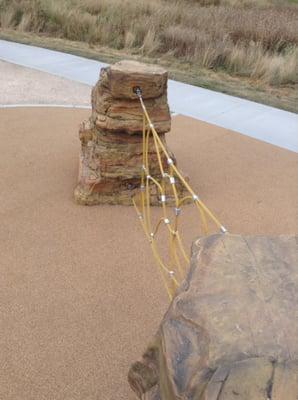 "Rock" boulder structure, with rope.