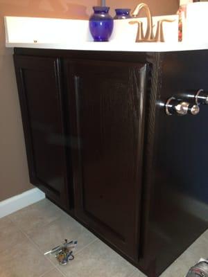 Oak bathroom vanity AFTER staining and refinishing.