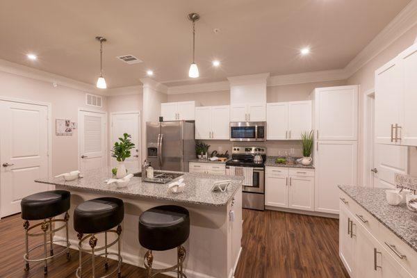 Kitchen and island bar in 1 bedroom condominium at Parc Gardens.