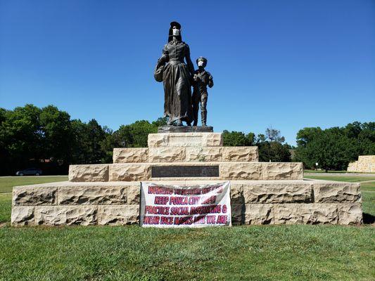 Pioneer Woman statue, with Covid-19 masks