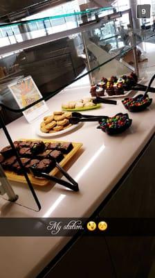 Our baker Justina is very excited about her M&M filled dessert station today!