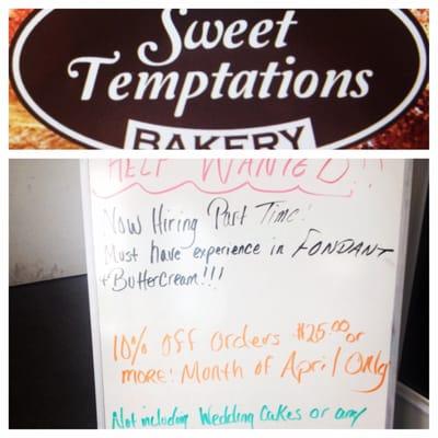 The advertising sign in the lobby of the Sweet Temptation bakery.