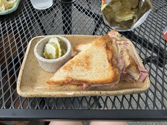 Gluten free Rueben, quality pickles, on adorable earthenware.