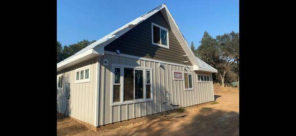 New James hardie siding board and batten on bottom floor matched with lap siding on the gables turned out beautiful!