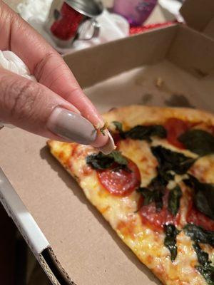 A screw in the pizza