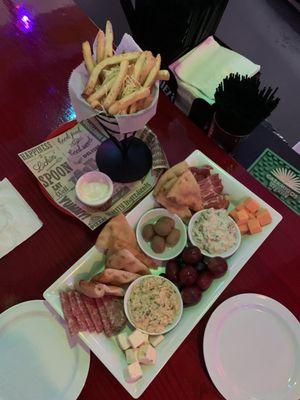 The POP Board: meats, cheeses, specialty olives, fruits, warm crunchy pita wedges, hummus and a Very Refreshing Spinach Dip.