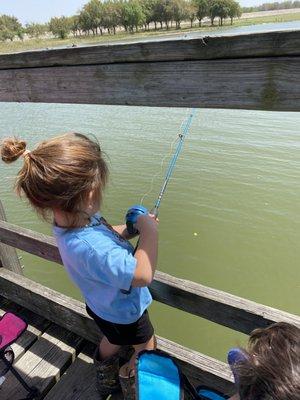 Our granddaughter fishing for the first time.