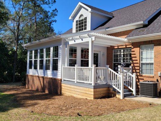 Sunroom addition with trex deck and pergola