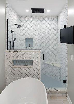 A full bathroom was added to this basement remodel.  The shower features multiple shower heads.