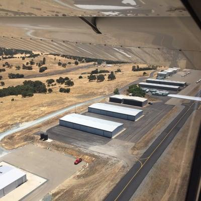 Hangars looking back after takeoff on runway 31