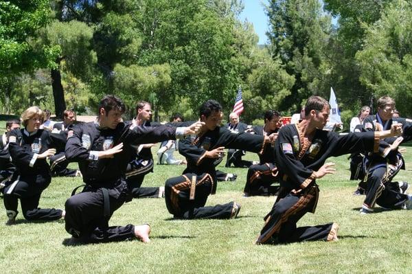 Instructors and Students Practicing movements from Pal Gae that develop balanced strength and flexibility throughout the body.