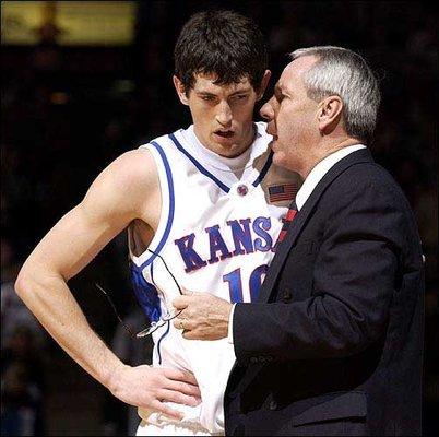 Former coach Roy Williams with point guard Kirk Hinrich.