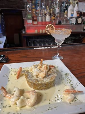 My go-to order on a Friday is shrimp mofongo with garlic sauce, paired with a margarita on the rocks.