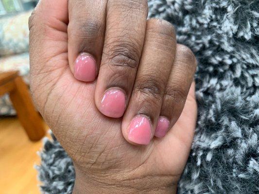 SNS nails, cuticles not trimmed, and natural nail underneath still shows.