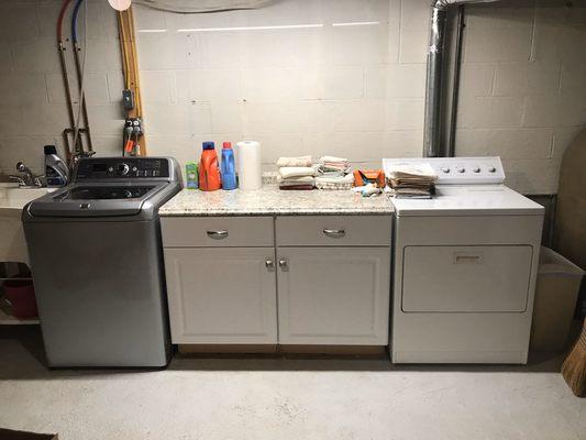 Laundry cabinets installed to provide storage and work space