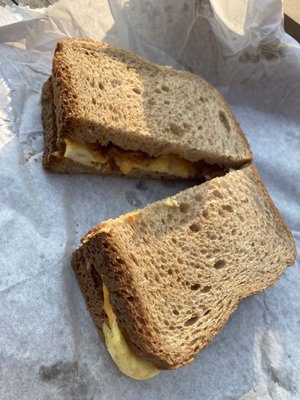 Bacon egg and cheese breakfast sandwich on wheat.