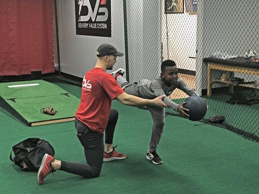 Pitcher executing drill with DVS Instructor