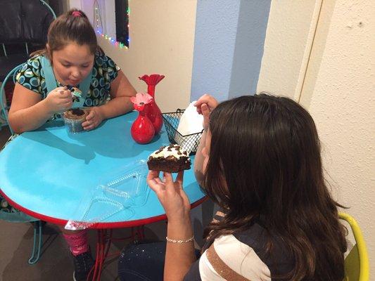 Enjoying our cupcake and brownies at this adorable little bakery!