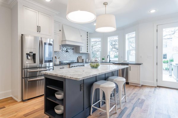 Inset Custom Cabinets
 Island Blue Shaker Inset Cabinet
 MSI Quartz Countertop
 Subway Tile
 Hardwood Floor