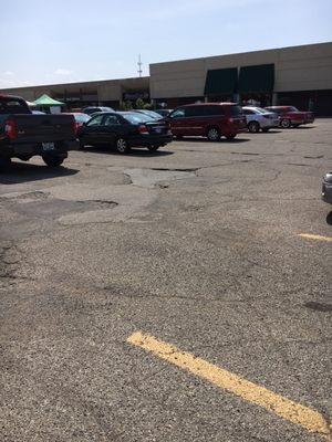 Parking lot is in horrible condition! Ridiculous !!