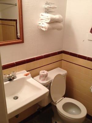 Clean bathroom, towels, and toilet. Basic but clean.