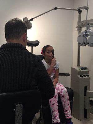 Dr. Ortiz examining my daughter her 1st eye exam!