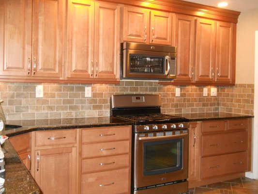 Complete Kitchen Remodel. Tile floor and back splash. Granite counter tops. Accent Lighting under top cabinets.