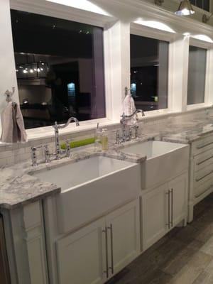 Quartzite countertops with two undermount farm sinks