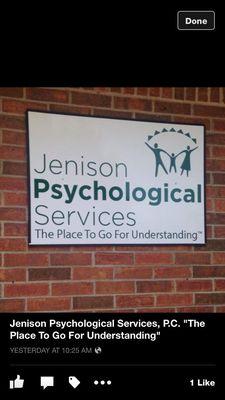 Sign and logo from side of office building .