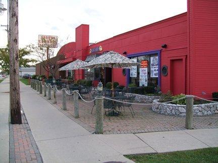 Patio seating, along with a built in table fire place for warm summer nights