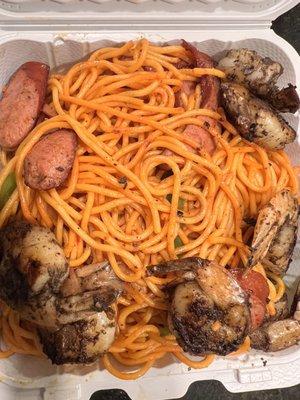 Haitian spaghetti with colossal jerk shrimp