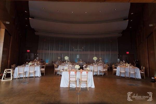 Draping (back), tables, chairs and linens from Event Party Rentals