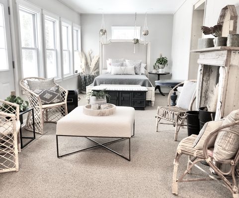 Selection of decor, salvaged mantle, chairs and bed.