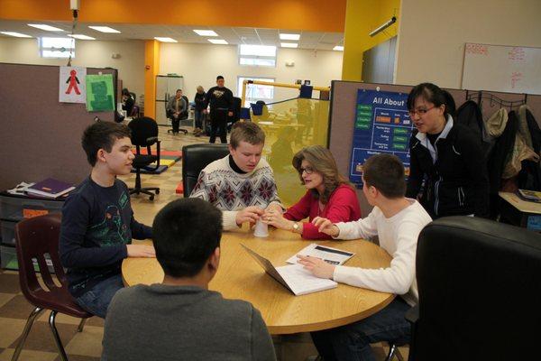 Students at The Aurora School working in a classroom.