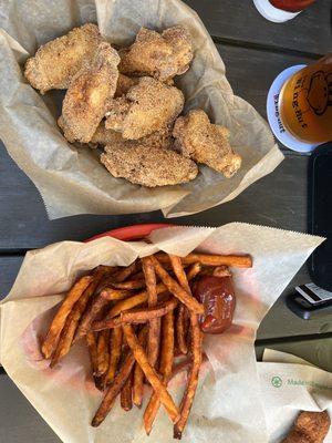 Pound of bone in wings with Hickory Hog rub and small sweet potato fries.