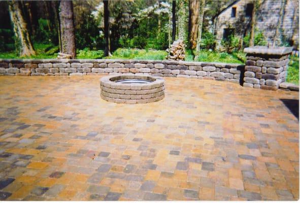 Patio with seating wall and fire pit