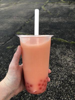 Strawberry passion green tea with coconut milk and strawberry popping boba. So yummy!!