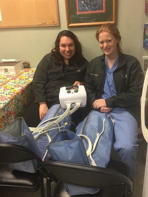 Dr. Chapman and Dr. Finn trying out lymphedema pumps at lunch!