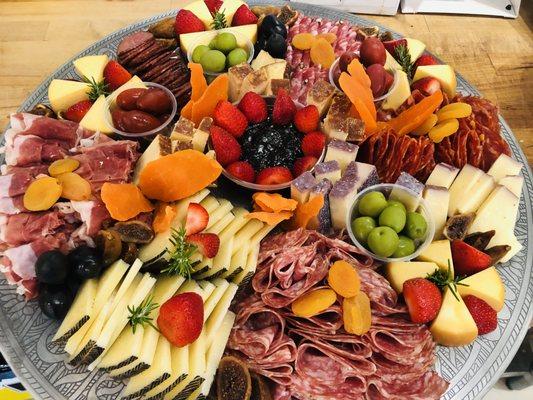 Charcuterie Tray serves 20-25 people. Order online www.savorygourmetmarket.com