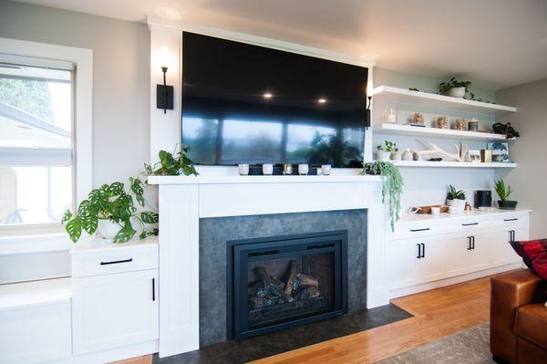 Home entertainment system with bench seating and matching floating shelves