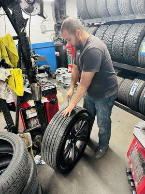 Christian fixing the flat tire