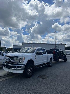 Ford towing a Chevy. Very nice Chevy though!