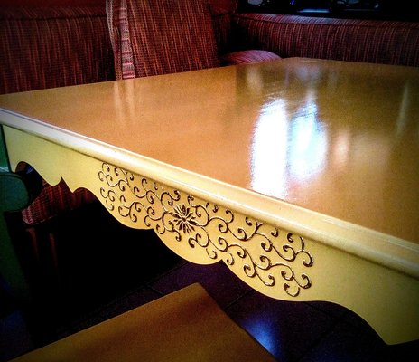 Painted table top with gold accents on table skirt (sides).