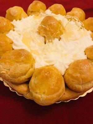 St. Honoré Cake - 10" bomb of decadence - Cream Puffs, Crème Pâtissière, Homemade Whipped Cream, And Caramel Sauce.