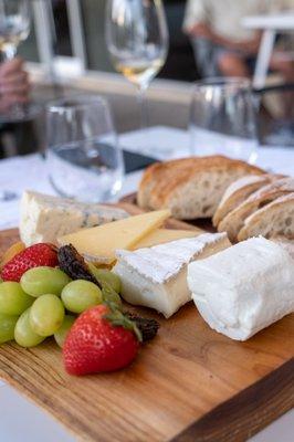 Cheese board sampling w/ fruit & bread.Photo credit  Kate Baumwell