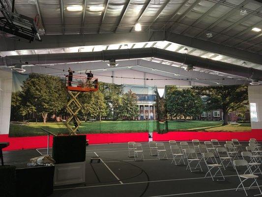 Ted and Tripp setting up a huge banner for St. Catherine's School Class of 2021 Graduation.