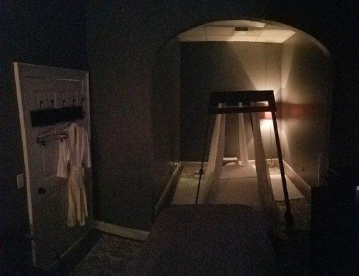 Inside clinic view of treatment room, Ashiatsu floor table with support bars (barefoot massage)