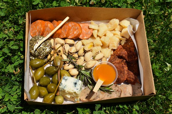 Local Farmers Box: Parmesan, Blue Cheese,  Goat Cheese, Beef Jerky, Spicy Chorizo, Chicken Sausage, Pistachios, Apricot Puree, Caperberries