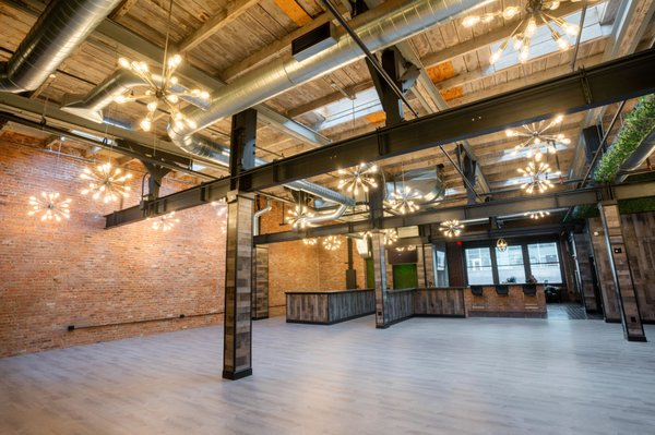 Modernized industrial space is layered in exposed brick