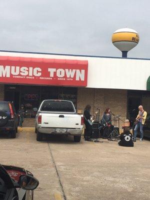 Burning Pages band played in parking lot for Rex Manning Day.